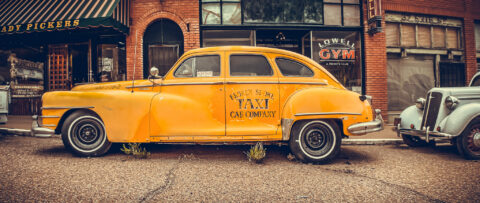 A photo of a vintage taxi car.