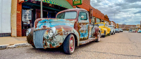 A photo of a vintage truck from the front.